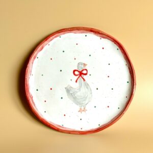 Тарелка с гусем и красным бантом